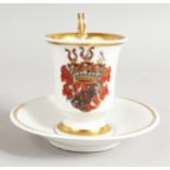 A BERLIN ARMORIAL CUP AND SAUCER.