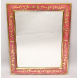 A RECTANGULAR WALL MIRROR, with red painted and gilt decorated frame. 3ft 2ins x 2ft 7ins.