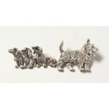 TWO SILVER AND RUBY DOG BROOCHES, SCOTTISH TERRIER AND THREE DACHSHUNDS. (2)