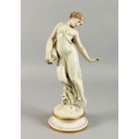 A ROYAL WORCESTER DANCING FIGURE OF A GIRL carrying a pitcher, on a circular base. 16ins high.