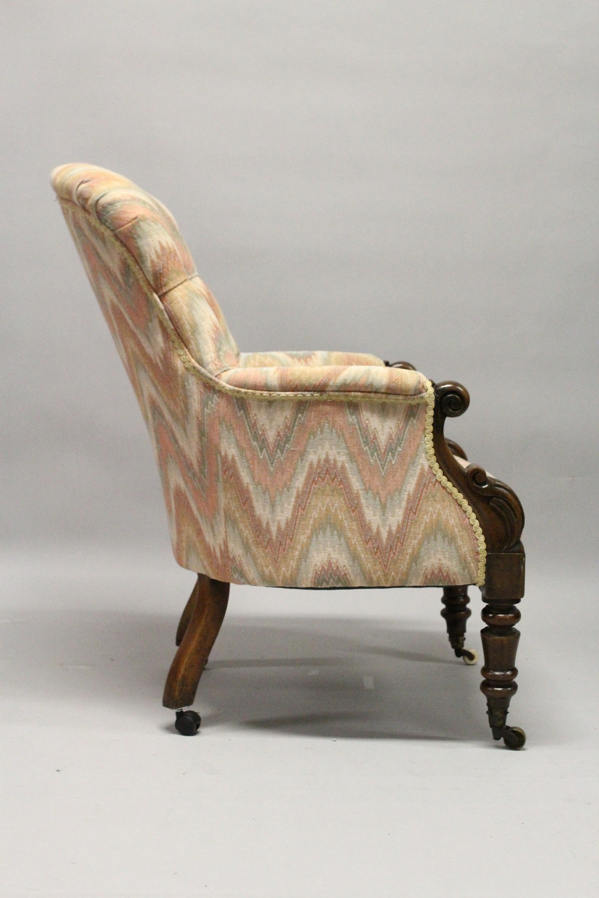 A 19TH CENTURY MAHOGANY FRAMED BUTTON UPHOLSTERED ARMCHAIR, with carved "C Scroll" arm caps, - Image 4 of 10