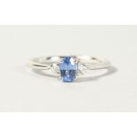 AN 18CT WHITE GOLD THREE STONE SAPPHIRE AND DIAMOND RING, 60 points.
