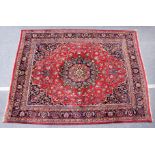 A PERSIAN CARPET, 20TH CENTURY, claret ground with allover stylised floral decoration. 11ft 4ins