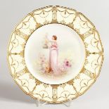 A ROYAL DOULTON PLATE painted with putting flowers into a vase on a plinth painted by Arthur Leslie,