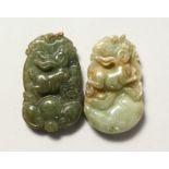 TWO CARVED CHINESE JADE PENDANTS.