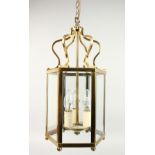 A BRASS OCTAGONAL HANGING LANTERN.