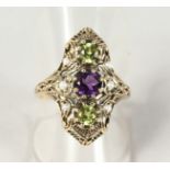 A SUPERB 9CT GOLD, PERIDOT, AMETHYST AND PEARL SUFFRAGETTE RING.