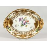 A VERY GOOD MEISSEN OVAL TWO-HANDLED TRAY, with gilt entwined dolphin handle, the border with