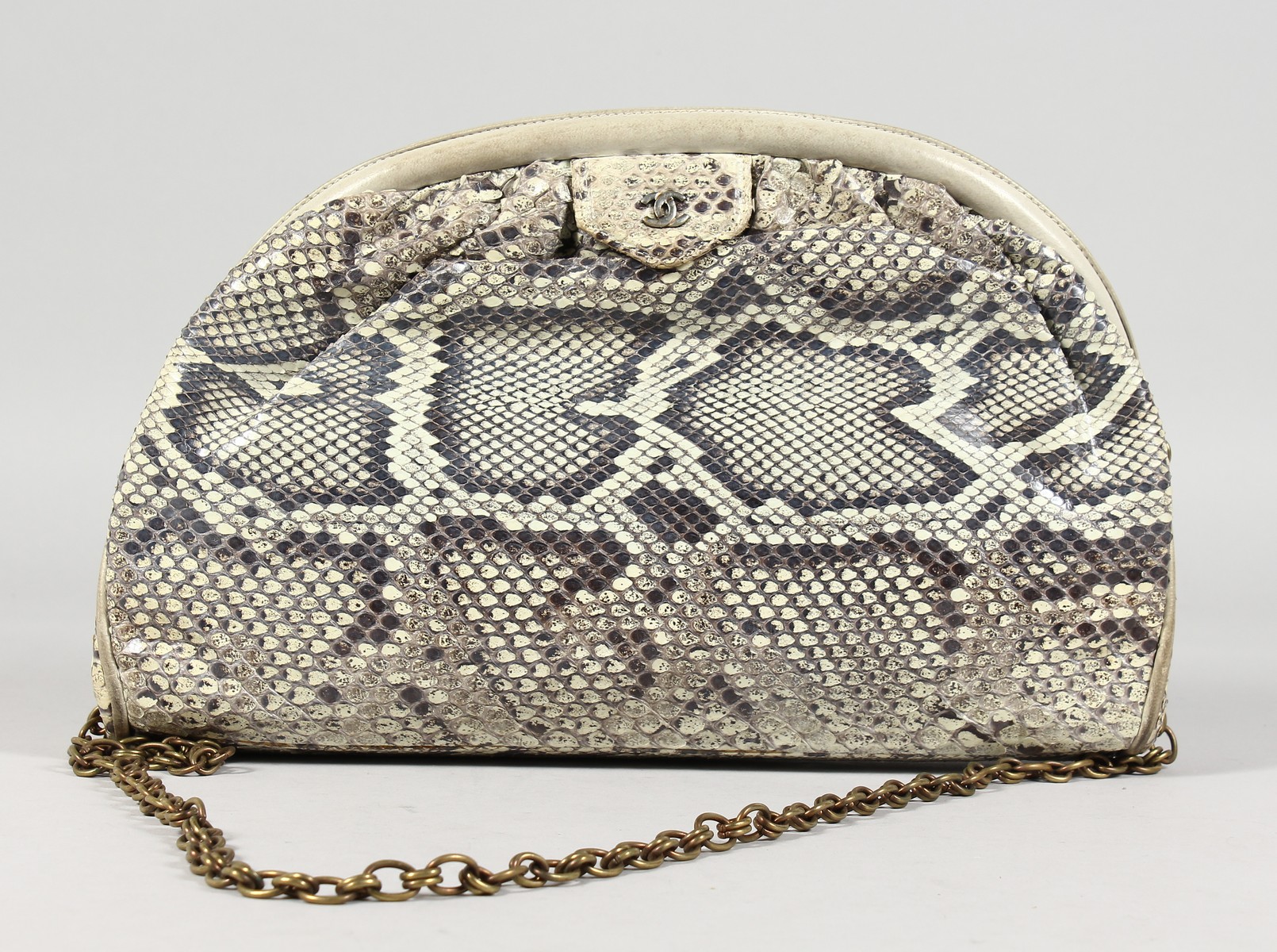 A CHANEL SNAKESKIN BAG with leather interior. Made in Italy. 11ins long.