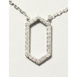 AN 18CT WHITE GOLD SIX SIDED DIAMOND PENDANT NECKLACE in the Art Deco style.