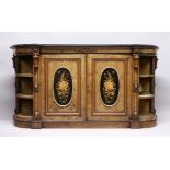 A GOOD VICTORIAN FIGURED WALNUT CREDENZA, with black marble top, the front fitted with a pair of