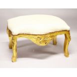 A GILTWOOD WINDOW SEAT with padded top.