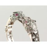 A SILVER, RUBY AND EMERALD PANTHER BRACELET.