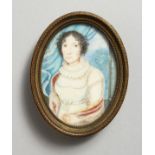 A SMALL 19TH CENTURY OVAL PORTRAIT MINIATURE, three-quarter length of a lady wearing a white