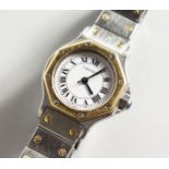 A LADIES CARTIER SILVER AND GOLD WRISTWATCH, No. 090770249, in original box.