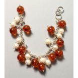 A SILVER, PEARL AND AMBER BRACELET.