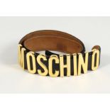 A MOSCHINO ITALIAN BLACK LEATHER AND GILT BELT. 33ins long.