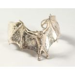 A HEAVY SILVER DESIGNER BAT BRACELET.