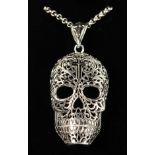 A LARGE SILVER CALAVERA SKULL PENDANT on a silver chain.