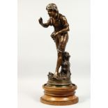 GREGORE A GOOD 19TH CENTURY BRONZE of a young man, standing by a tree stump, a birds nest in his