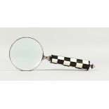 A MAGNIFYING GLASS WITH CHEQUERED HANDLE.