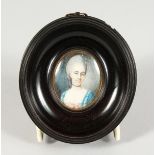 AN 18TH/19TH CENTURY OVAL PORTRAIT MINIATURE, bust length of a lady wearing a blue dress, in an