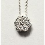 A SUPERB 18CT WHITE GOLD CLUSTER DIAMOND PENDANT, approx 1ct, on a chain.
