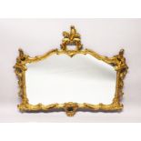 A CHIPPENDALE STYLE GILT FRAMED OVERMANTLE MIRROR, EARLY 20TH CENTURY, of ornate rococo form, with