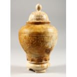 AN ALBASTER JAR AND COVER, of baluster form, relief carved with a grape and vine decoration. 8.75ins
