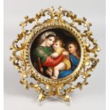 A GOOD DRESDEN CIRCULAR PLAQUE, Mother and two children 5.5ins diameter, in an Italian gilt frame.
