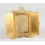 A FOLDING GILT BRONZE PHOTOGRAPH FRAME.