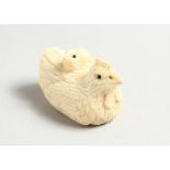 A SMALL CARVED BONE CHICKEN NETSUKE.