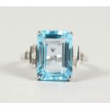 A GOOD 18CT WHITE GOLD, BLUE TOPAZ (10.5CTS) AND DIAMOND RING.