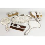 A SILVER SIX-PIECE DRESSING TABLE SET, comprising tray, hand mirror, hand brush, pair brushes and
