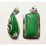 TWO SILVER AND JADE PENDANTS.