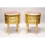 A GOOD PAIR OF GILTWOOD OVAL BEDSIDE CABINETS with marble tops.