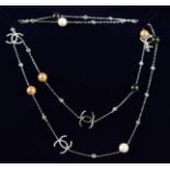 A CHANEL STYLE THREE COLOUR PEARL AND BRILLIANT SET NECKLACE.