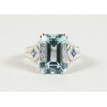 A SUPERB 18CT WHITE GOLD, AQUAMARINE (7.5CTS) AND DIAMOND RING.