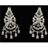A PAIR OF WHITE GOLD DIAMOND DROP EARRINGS.