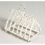 A SILVER PLATED CROSS GUNS TOAST RACK.