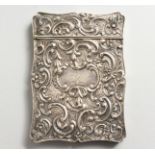 A VICTORIAN SILVER CALLING CARD CASE by JOSEPH WILLMORE, decorated with scrolls and flowers,