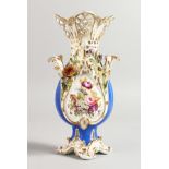 A COALPORT FINE VASE with pierced neck and encrusted flowers finely painted on a matte blue