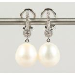 A GOOD PAIR OF 18CT WHITE GOLD, PEARL AND DIAMOND DROP EARRINGS.