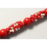 A SILVER, CORAL AND PEARL BRACELET.