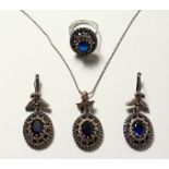 A SILVER AND GOLD PLATED FAUX SAPPHIRE THREE PIECE SET.