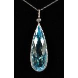 A GOOD 18CT WHITE GOLD, BLUE TOPAZ AND DIAMOND PENDANT on a chain.