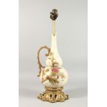 A DECORATED EWER SHAPED PORCELAIN AND GILT METAL MOUNTED LAMP BASE. 22ins high.