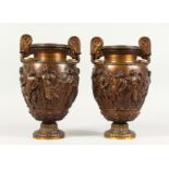 A PAIR OF SUPERB QUALITY 19TH CENTURY BRONZE RENAISSANCE DESIGN TWO-HANDLED URNS, the sides with