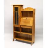 AN ART NOUVEAU OAK BUREAU BOOKCASE, with open shelves, a small drop flap, glazed door, on shaped