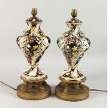 A GOOD PAIR OF ZSOLNAY PIERCED PORCELAIN VASES, on gilt stands converted to lamps. 17ins high.